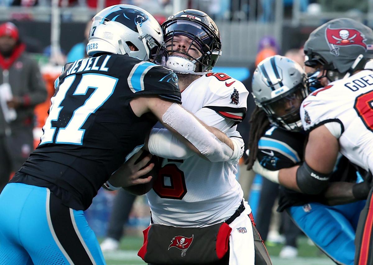 Carolina Panthers linebacker Josey Jewell, left, sacks Tampa Bay Buccaneers quarterback Baker Mayfield, right, during action at Bank of America Stadium in Charlotte, NC on Sunday, December 1, 2024.