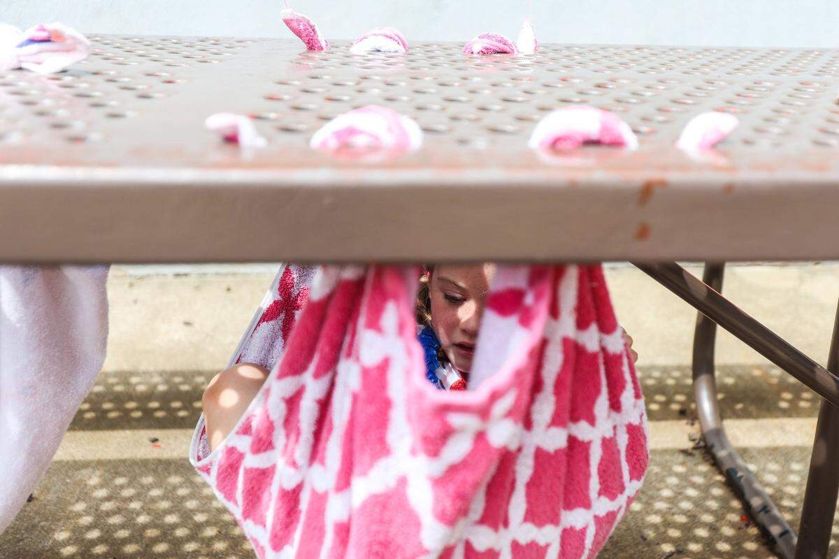 Devin Naseman, 5, enjoys solo time in a towel hammock during summer camp at St. Matthew Catholic School in 2022.