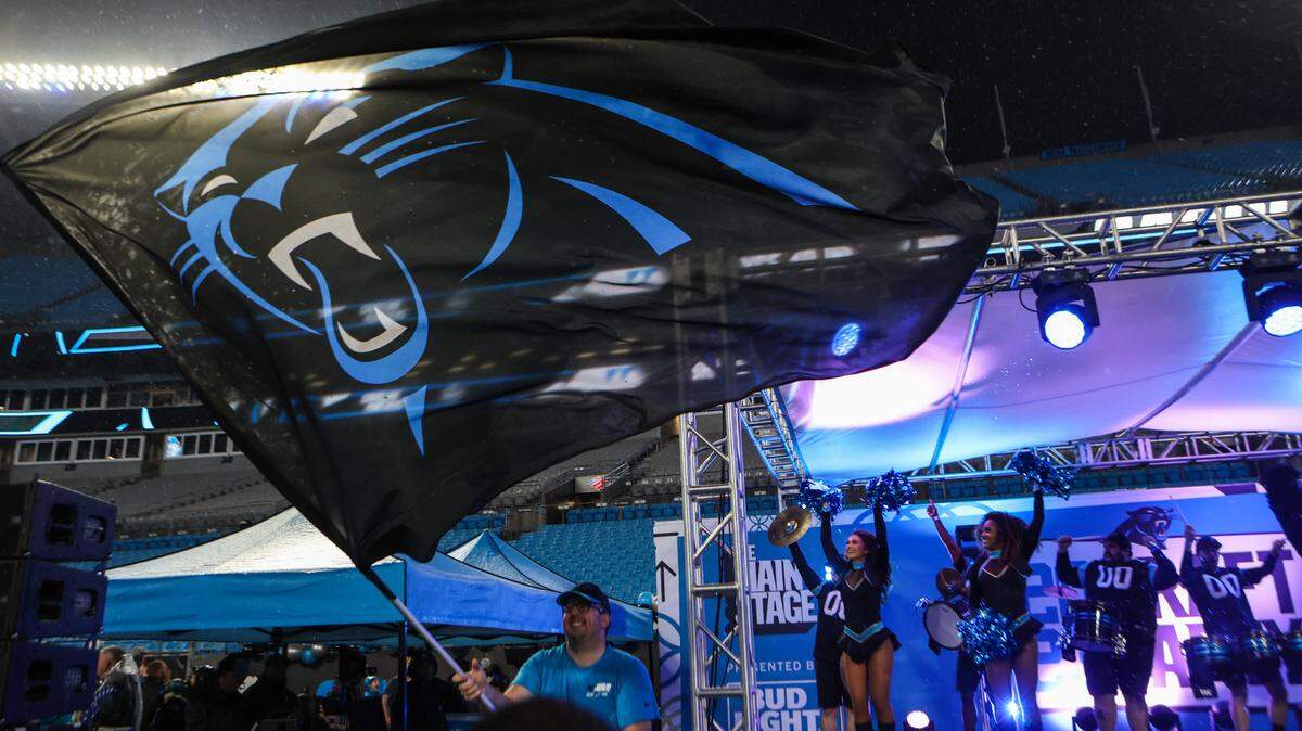 Celebration ensues on the main stage as the Panthers pick quarterback Bryce Young as the number one pick during in the NFL Draft during a fan watch party at Bank of America Stadium on Thursday, April 27, 2023.