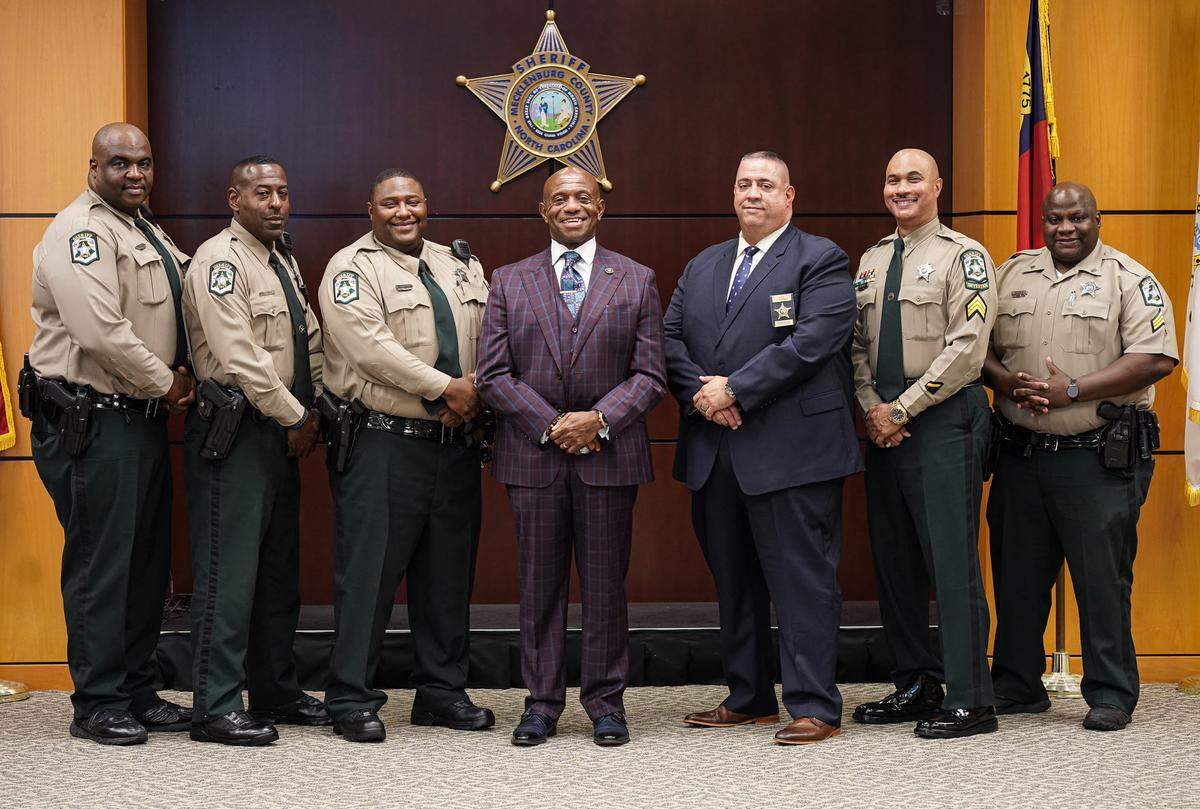 Sheriff Garry McFadden announced six promotions on Oct. 4, 2019. One of the men promoted was Jeff Eason, (in blue suit next to McFadden). Now retired, Eason said McFadden lived “by his own mood” and that it took little to land on his bad side.