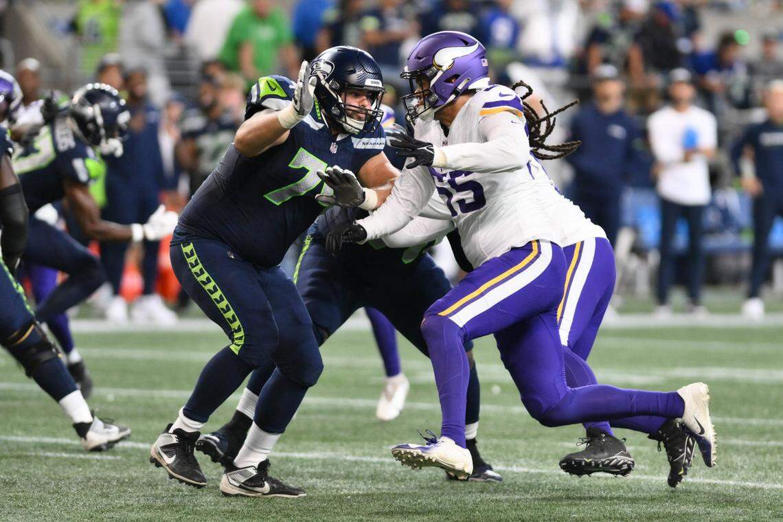 Aug 10, 2023; Seattle, Washington, USA; Seattle Seahawks offensive tackle Jake Curhan (74) blocks Minnesota Vikings linebacker Andre Carter II (55) at Lumen Field. Mandatory Credit: Steven Bisig-USA TODAY Sports