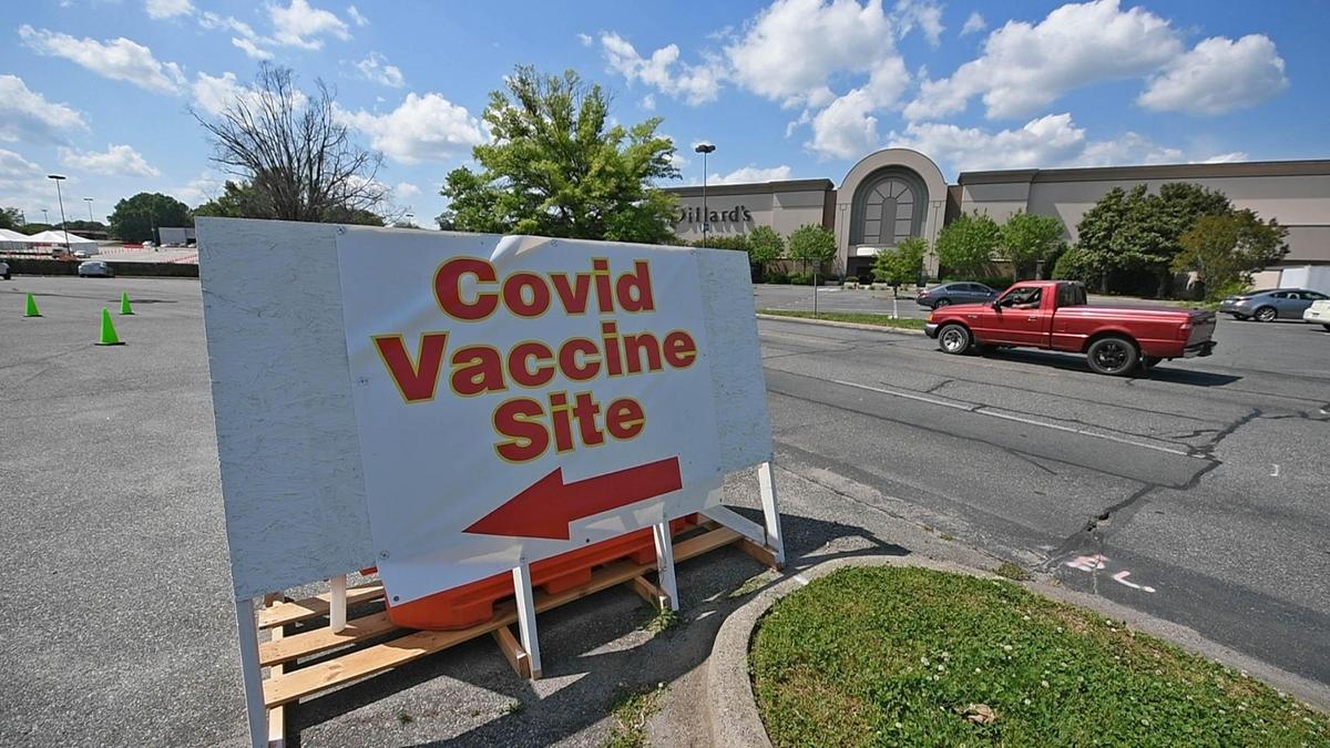 A car passes by the entrance of a vaccination site sponsored by Gaston County Public Health at Eastridge Mall on Wednesday, April 28, 2021. Assistant Health Director Brittain Kenny of Gaston County Public Health is the unofficial vaccine coordinator on vax clinic days, racing to businesses at the Eastridge Mall in Gastonia to ensure no doses are wasted. Demand has decreased noticeably. On this day, no vaccines were left over.