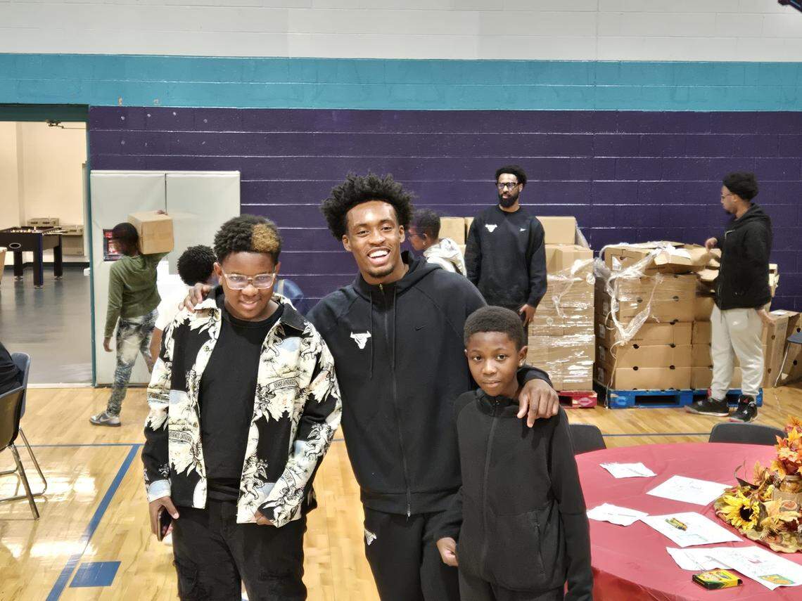 Charlotte Hornets guard Collin Sexton poses with fans during an event he hosted at the Boys & Girls Club in Charlotte.