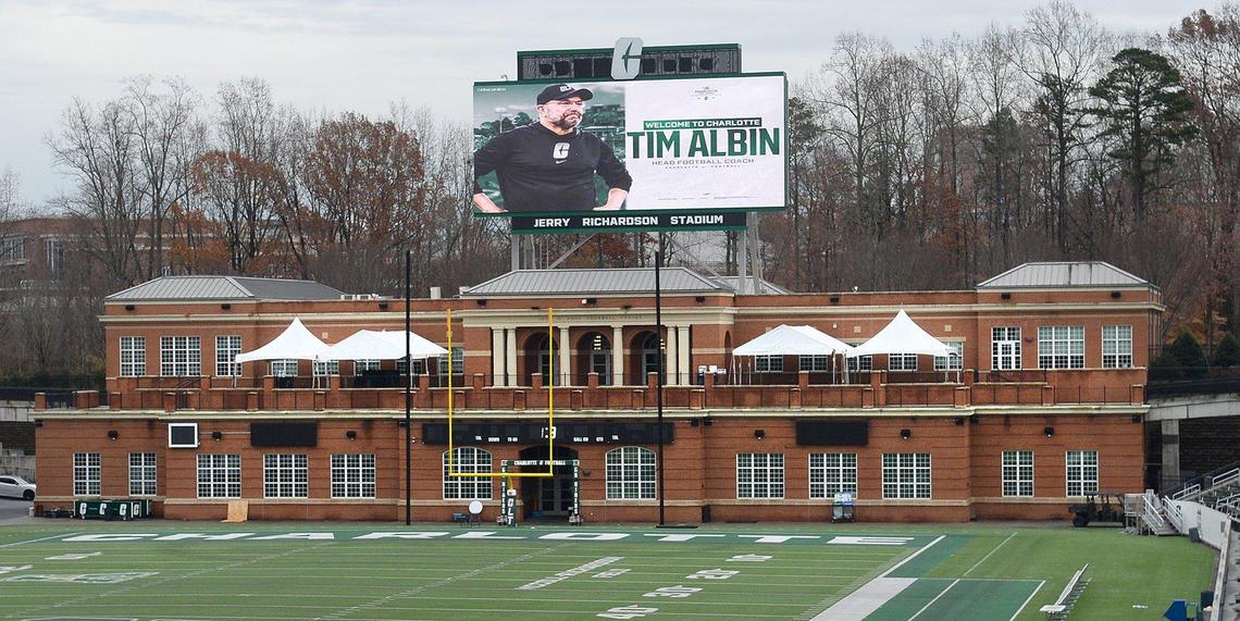 Even before the official press conference, UNC Charlotte touted their new coach Tim Albin on digital billboards at Jerry Richardson Stadium.