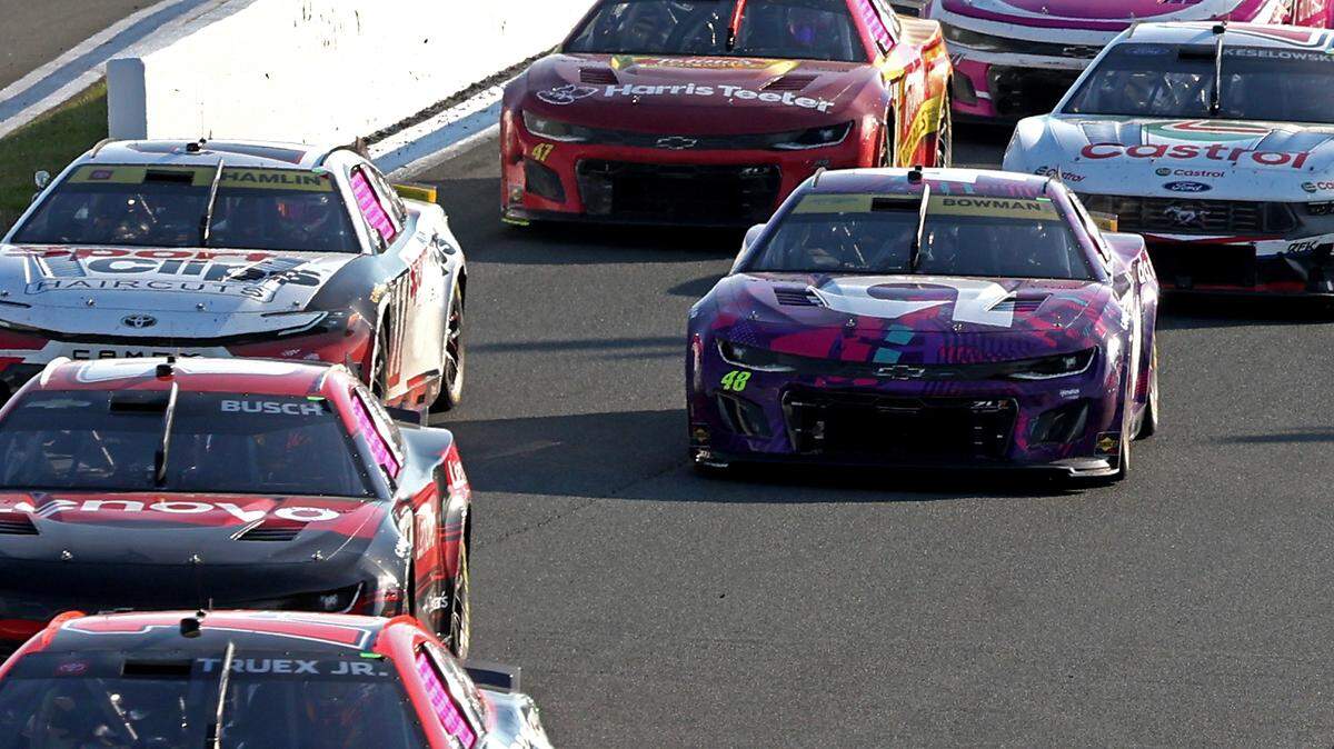 NASCAR driver Alex Bowman, right, follows the field out of Turn 2 during the Bank of America Roval at Charlotte Motor Speedway in Concord, NC on Sunday, October 13, 2024. The number 48 driven by Bowman was disqualified following post-race inspection.The car was found to be too light.