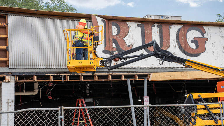 Photos: Stanley Drug Store sign comes down in Charlotte