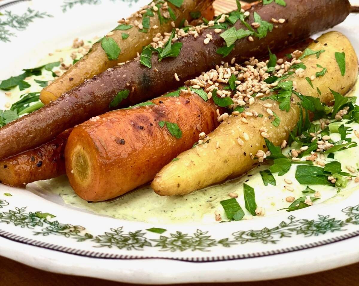 Haberdish’s new Braised Rainbow Carrots&nbsp;include a charred parsley crema and candied benne seeds,