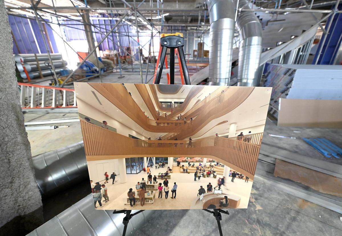 An artist’s rendering gives visitors a view of the future lobby area when entering from Tryon Plaza to Charlotte Mecklenburg Library’s new Main Library on North Tryon St. on Friday, October 10, 2025. The new library is schedule to open in 2027.