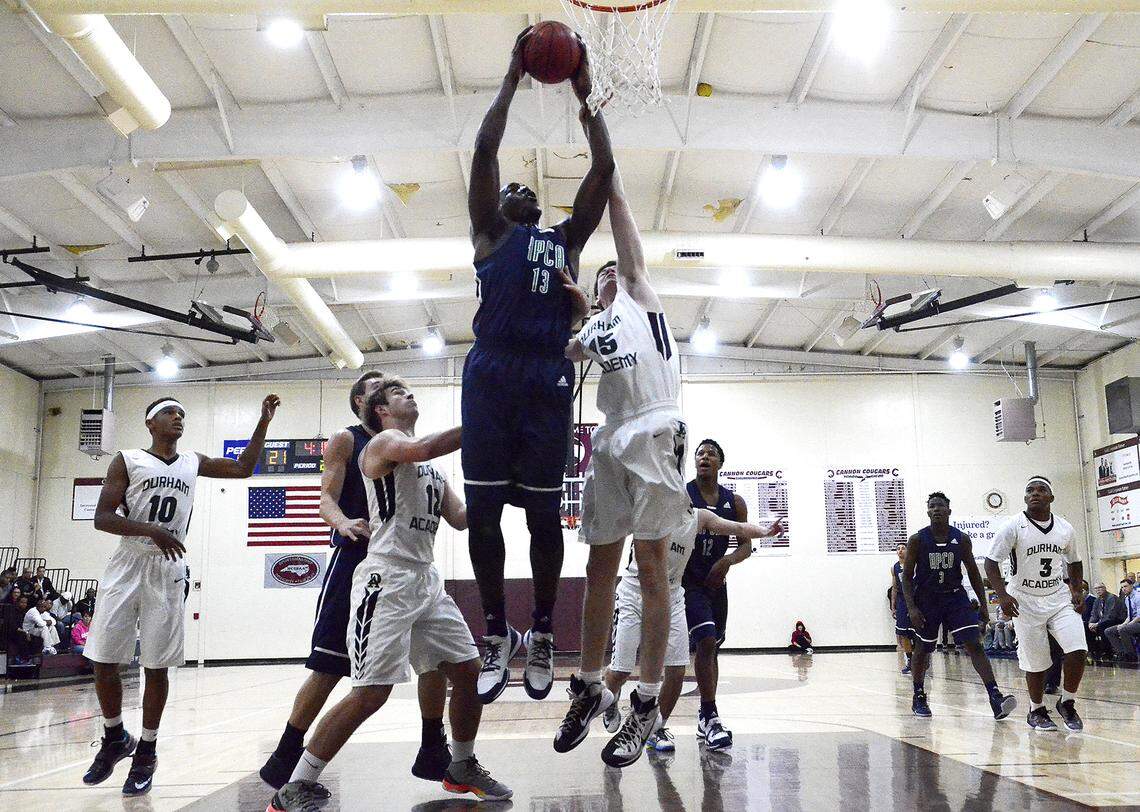 High Point Christian power forward Edrice "Bam" Adebayo, #13, goes for a rebound against Durham Academy. Adebayo, a Kentucky signee who was ranked among the nation's top 10 players squared off against other in-state players on Nov. 21, 2015.