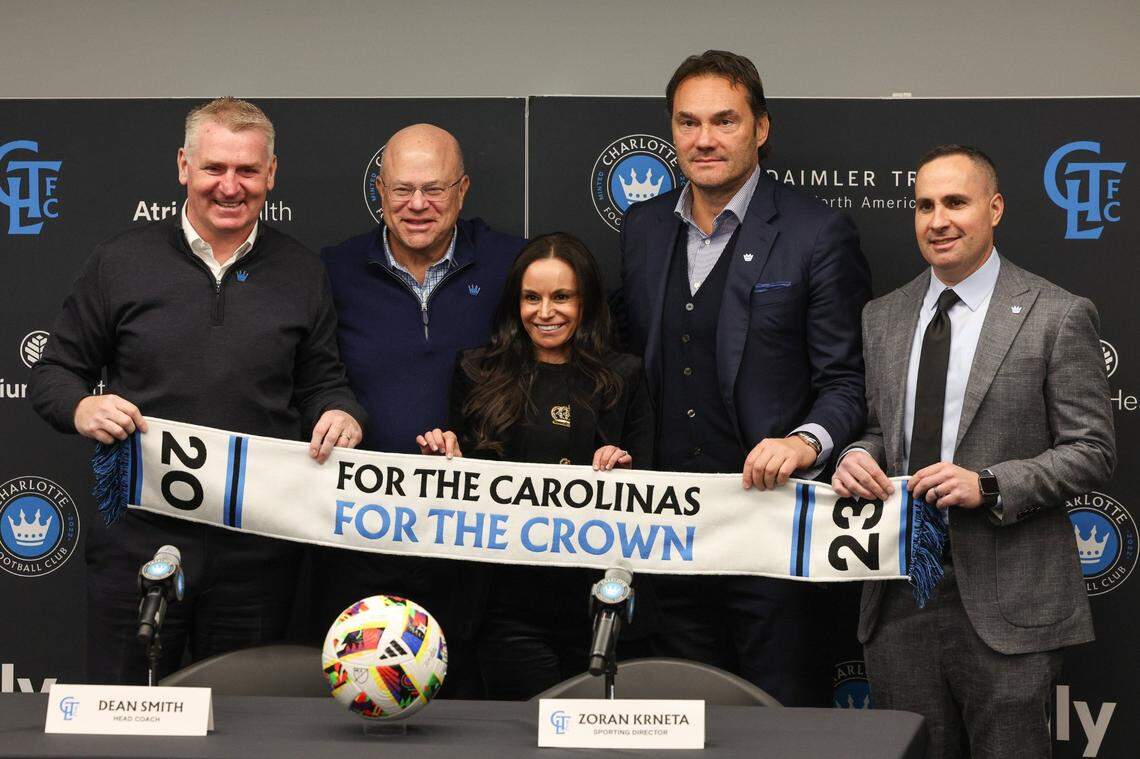 Charlotte FC’s new head coach Dean Smith, team owner David Tepper, Nicole Tepper, Charlotte FC sporting director Zoran Krneta and Charlotte FC President Joe LaBue pose at the end of an introductory press conference for Smith at Atrium Health Performance Park on Monday, December 18, 2023.