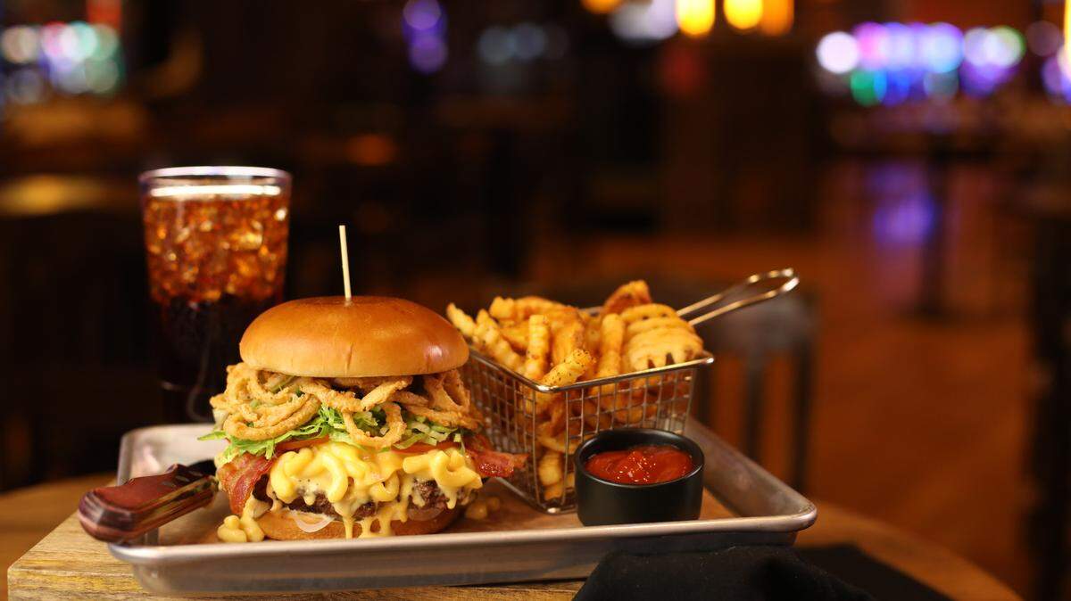 The Bacon Mac-N-Cheese Burger at Guy Fieri’s Cherokee Kitchen + Bar.