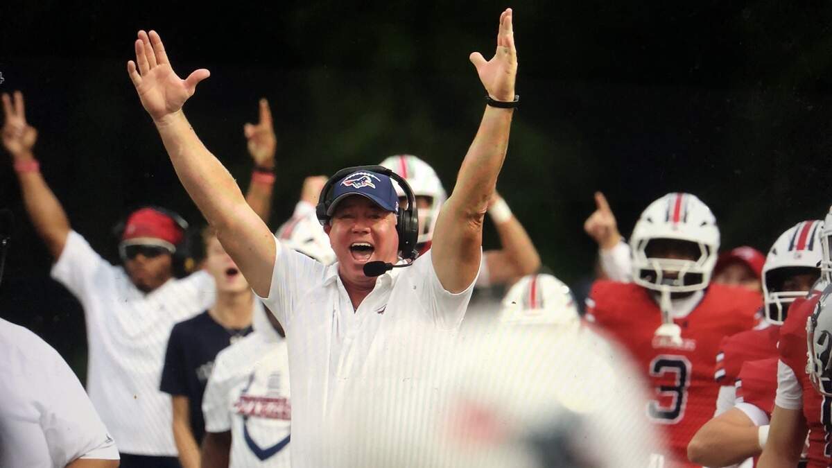 Providence Day coach Chad Grier cheers a score by his team in Friday’s win over Myers Park
