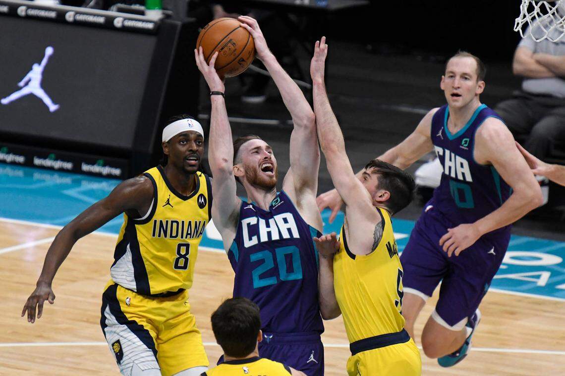 Charlotte Hornets forward Gordon Hayward (20) goes up between Indiana Pacers guard Justin Holiday (8) and guard T.J. McConnell (9) Wednesday. Hayward, averaging 23.6 points per game, has clearly established himself as the Hornets’ best player in his first season with the team.