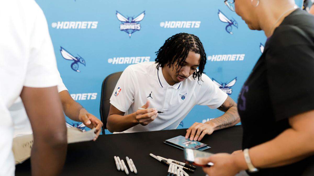 Nick Smith Jr., newly drafted to the Charlotte Hornets signs autographs after a press conference at Spectrum Center on Friday, June 23, 2023.