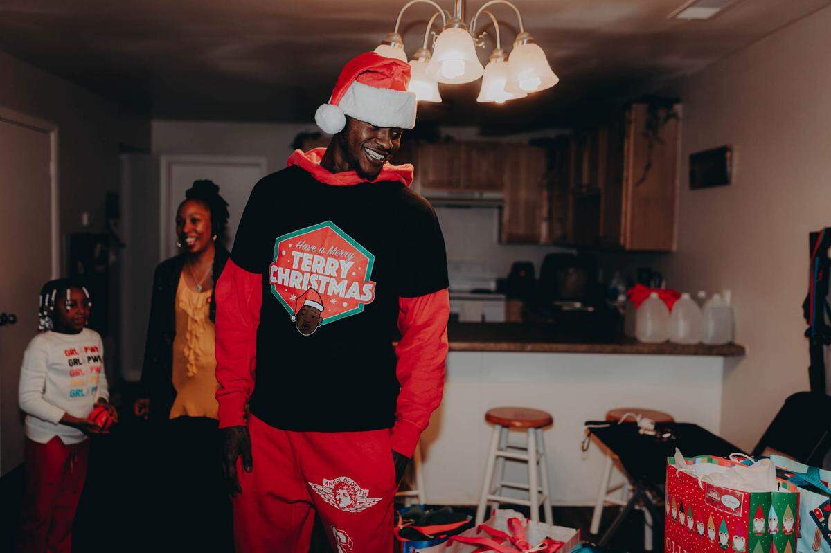 Hornets guard Terry Rozier is all smiles after delivering gifts as part of his fourth annual “Merry Terry Christmas.” Rozier’s foundation donated to five different organizations that work closely with single-mothers, families and children in need.