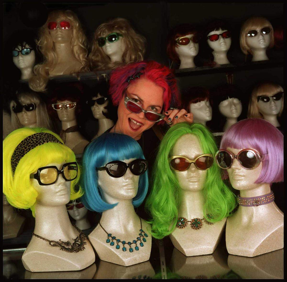 An October 1997 photo caption in The Charlotte Observer stated that wigs and glasses were in with Hope Nichols, “the Queen of Cutting Edge in Charlotte”. When she was the manager at Superior Feet, Nichols displayed a few of the wigs and glasses that could be found in the store at 1500 Central Avenue.