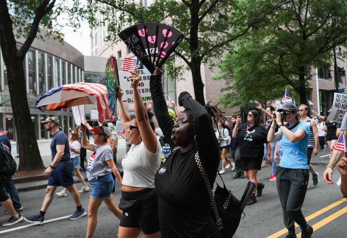 Protestors march during the No Kings protest along Tryon Street in Charlotte on Saturday, June 14, 2025. A second day of No Kings protests is scheduled for Saturday, Oct. 18.