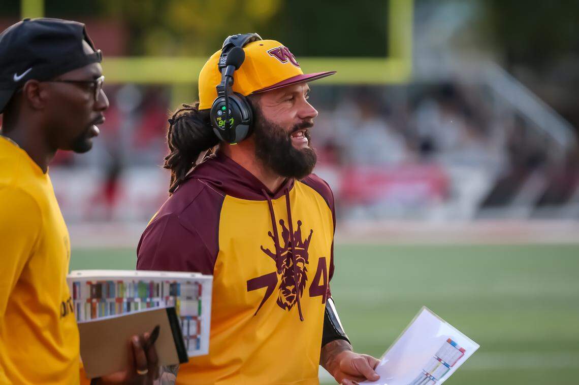 West Charlotte head coach Sam Greiner scans the field while directing his players from the sideline at Monroe high school on Friday August 29, 2025 in Monroe, NC
