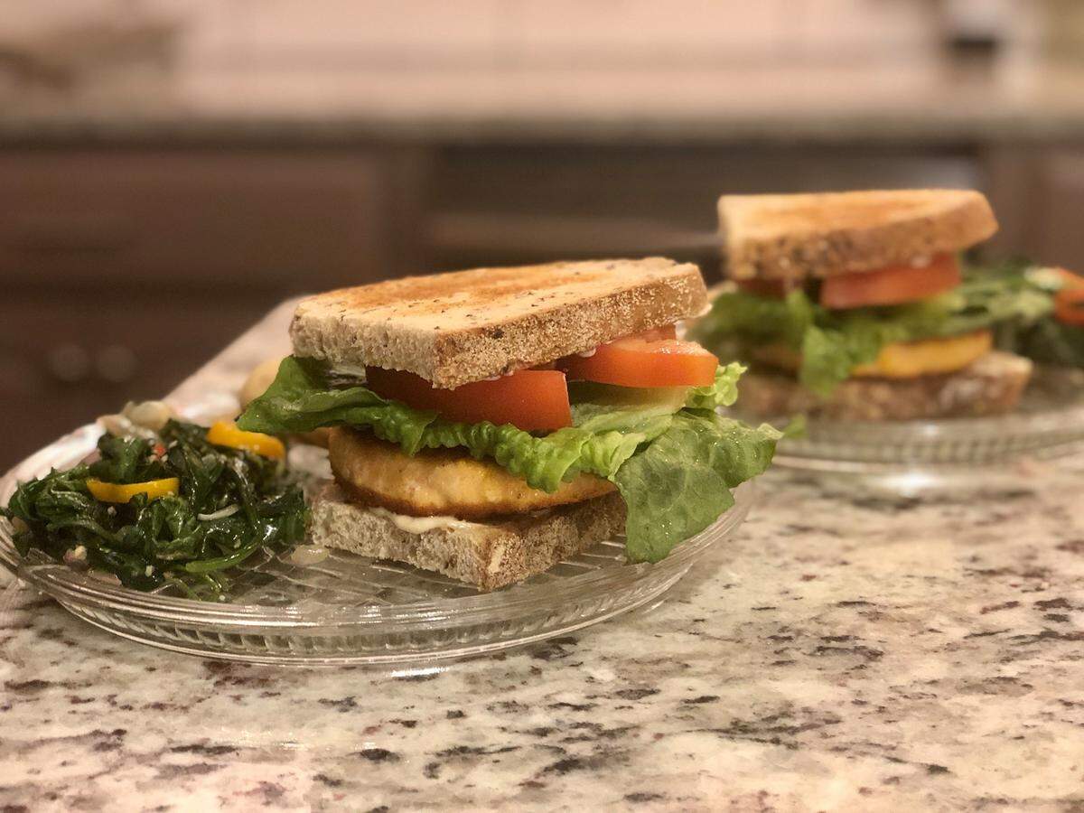 Dani Nelson posted her meal in the Fatten The Curve: deli pre-made salmon bacon burger patties with garlic aioli, side of sautéed spinach with chopped onion and a few sweet peppers.
