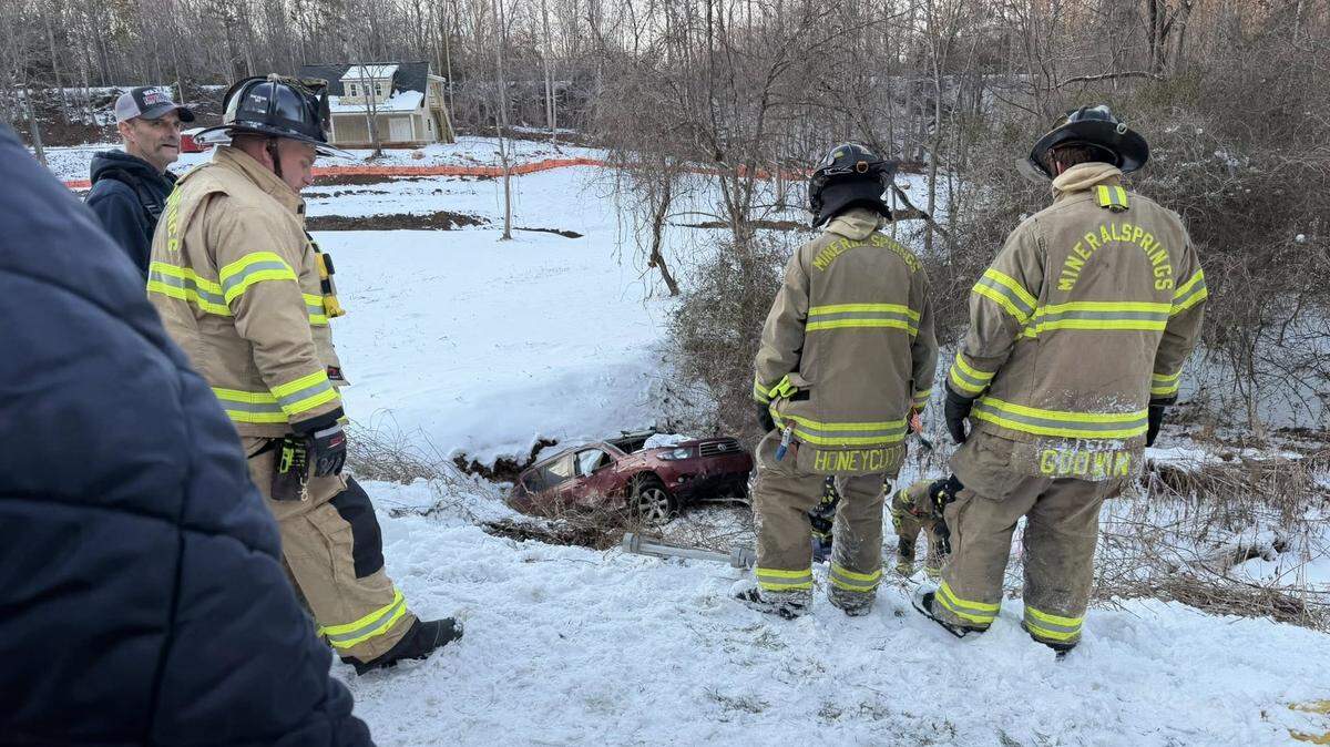 Fire and rescue officials from Waxhaw and nearby agencies helped free two people who were stuck when their SUV went into a creek on Sunday.