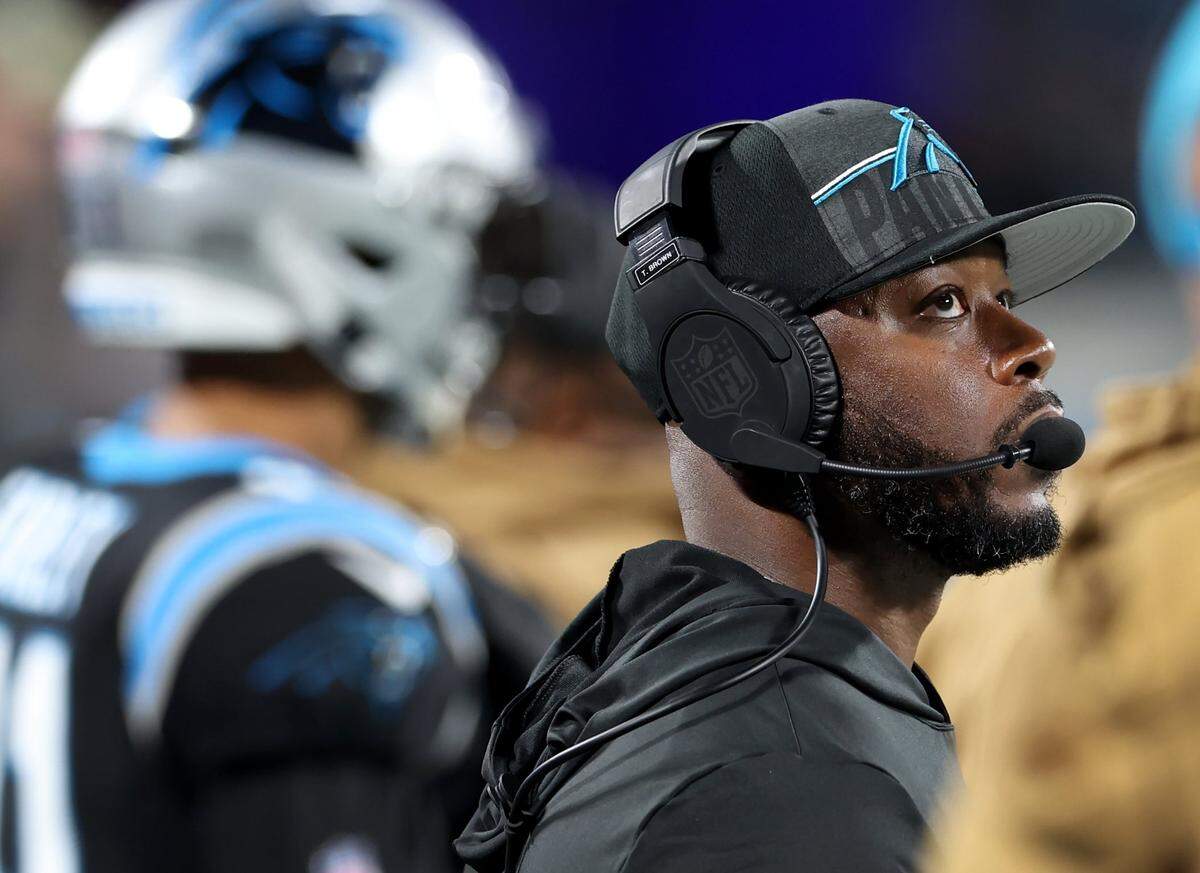 Carolina Panthers offensive coordinator Thomas Brown looks at the Jumbotron during a replay of fourth-quarter action against the Indianapolis Colts on Sunday, November 5, 2023 at Bank of America Stadium in Charlotte, NC. The Colts defeated the Panthers 27-13.