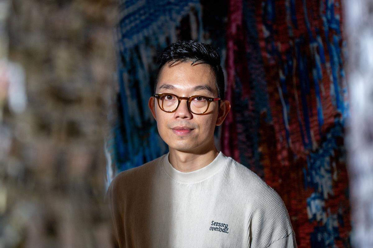 Kenny Nguyen, a Charlotte based artist, works with strips of silk to pay homage to his Vietnamese heritage in his Concord studio in Concord, NC, Tuesday August 1, 2025.