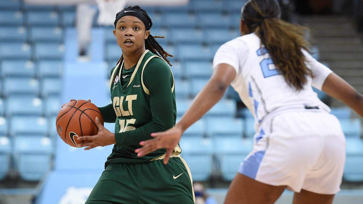 Charlotte’s Jada McMillian looks to pass against North Carolina in Chapel Hill last month. She is averaging 17.6 points and 4.6 assists per game this season.