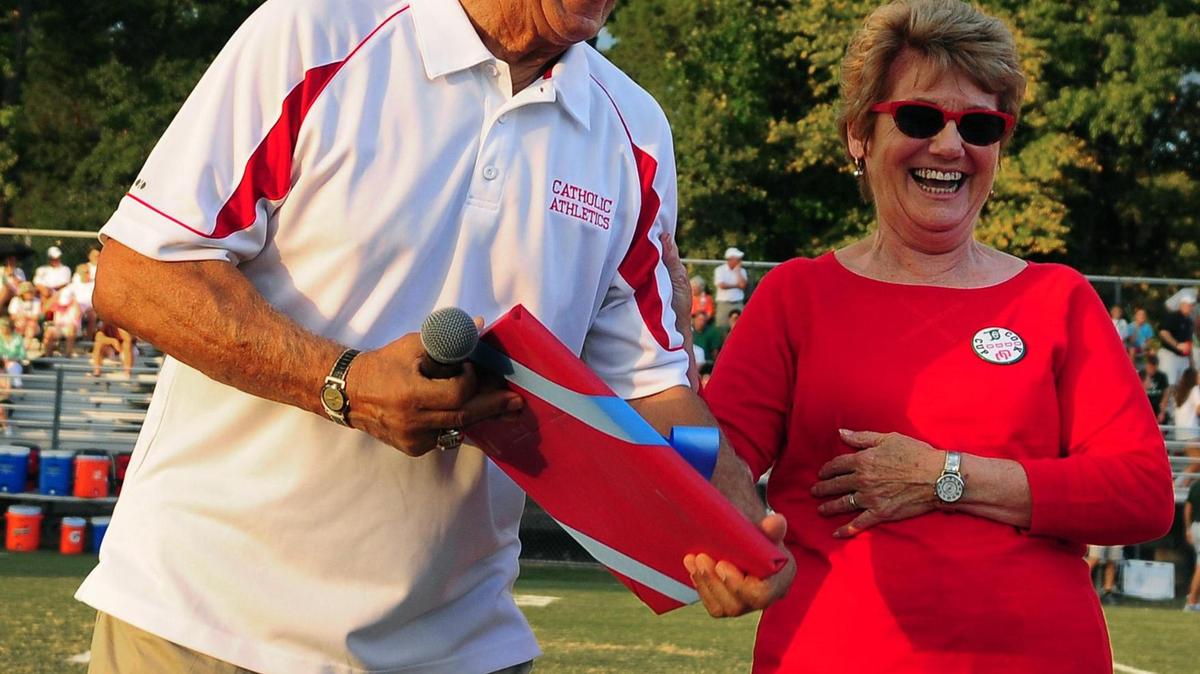 Former Charlotte Catholic head coach Jim Oddo shares a laugh with his wife, Lorraine Oddo prior to the team’s game vs Charlotte Country Day in the Cook Cup at Charlotte Catholic on Friday, September 5, 2014.
