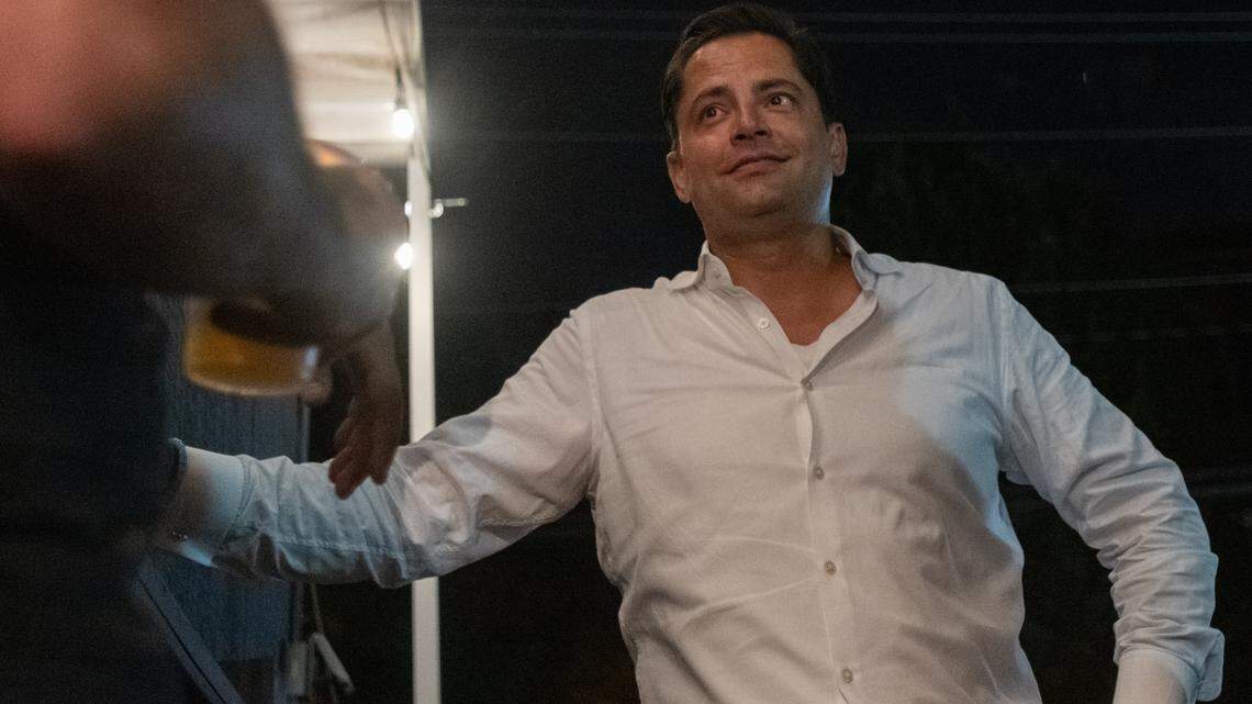 Tariq Scott Bokhari, City Council District 6 incumbent Republican candidate, chats with a group of supporters at Selwyn Avenue Pub in Charlotte, N.C. as ballots are counted on Tuesday, July 26, 2022. Bokhari beat out Democratic candidate Stephanie Hand for the seat by less than 400 votes. 