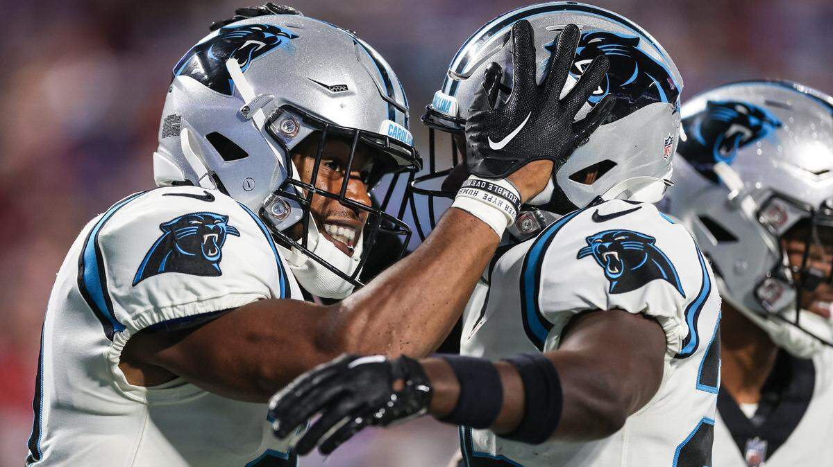Panthers safety Jeremy Chinn celebrates with teammates after making an interception during the game against the Bills at Bank of America Stadium on Friday, August 26, 2022 in Charlotte, NC.