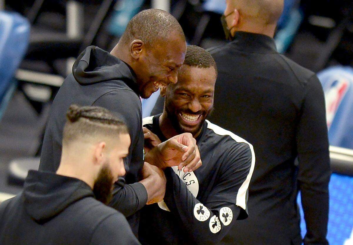 Charlotte Hornets center Bismack Biyombo, left and Boston Celtics guard Kemba Walker, right, enjoy a reunion prior to the start of NBA game action at Spectrum Center in Charlotte, NC on Sunday, April 25, 2021.