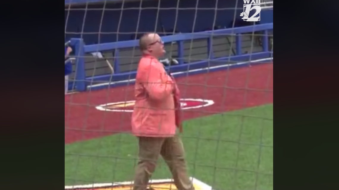 Chuck Hayworth tries his hand at singing the National Anthem Sunday in High Point, despite getting over heated.