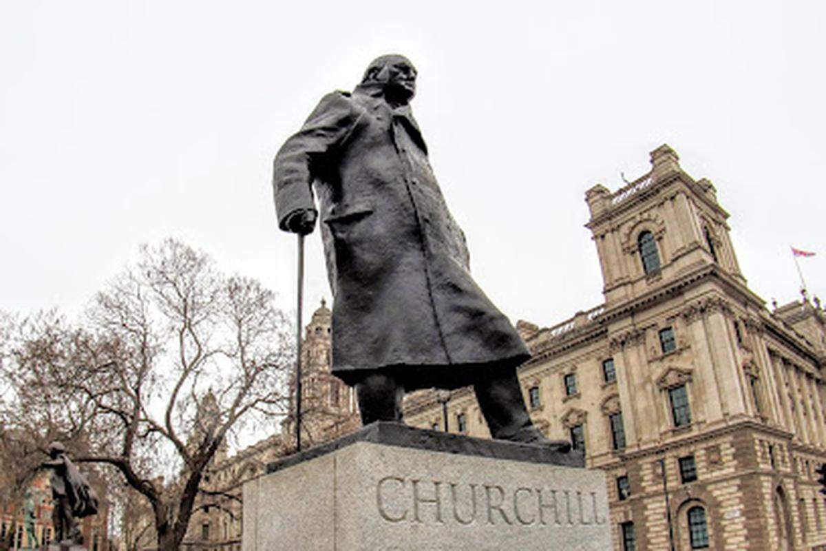 The Winston Churchill sculpture stands 12 feet high on the main green of Parliament Square, opposite the Palace of Westminster in London , England.
