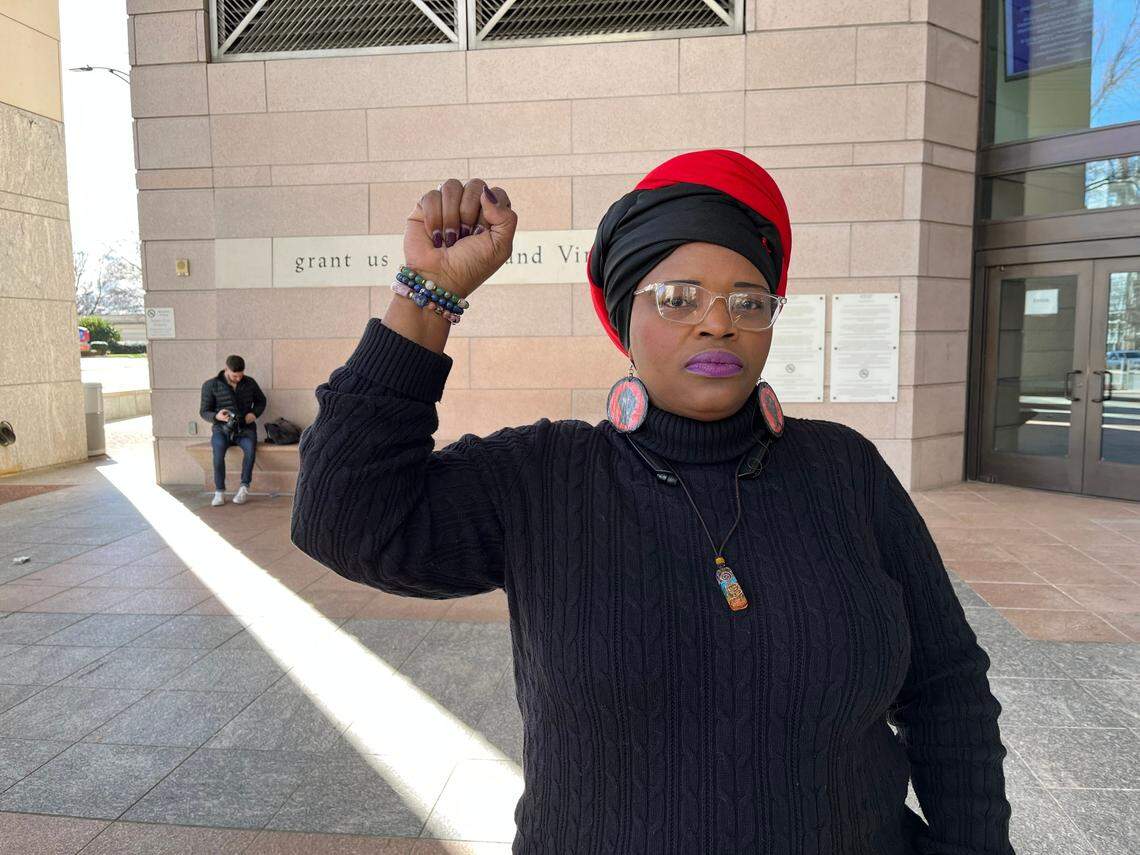 Melissa Funderburk protests outside the Mecklenburg County Courthouse in uptown Charlotte on Saturday, Jan. 28, 2022. A crowd of 50 gathered to protest the fatal beating by police of Tyre Nichols in Memphis.