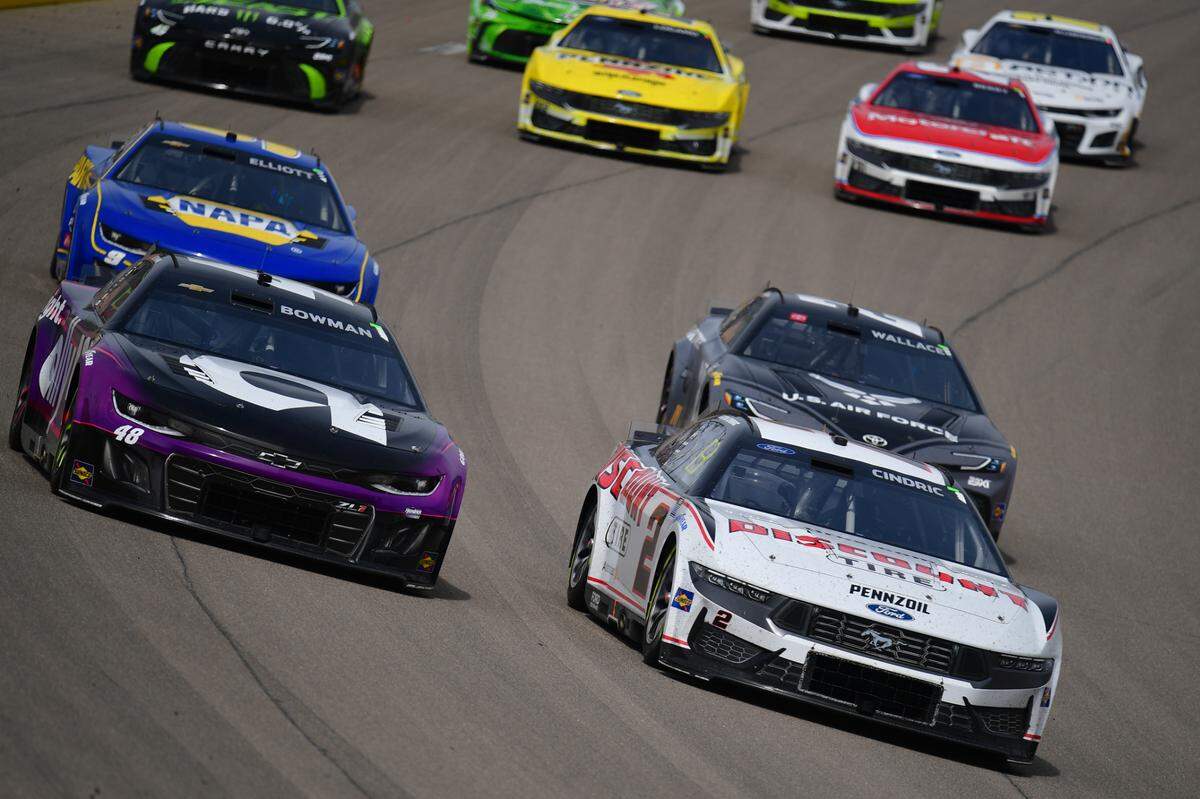 Mar 16, 2025; Las Vegas, Nevada, USA; NASCAR Cup Series driver Austin Cindric (2) leads during the Pennzoil 400 at Las Vegas Motor Speedway.