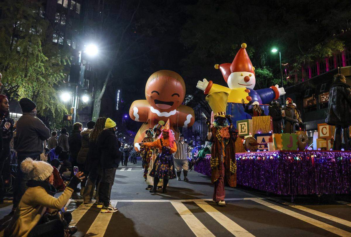 Balloons make their way through an intersection at the Novant Health Thanksgiving Day Parade in Charlotte, N.C., on Wednesday, November 24, 2021. 