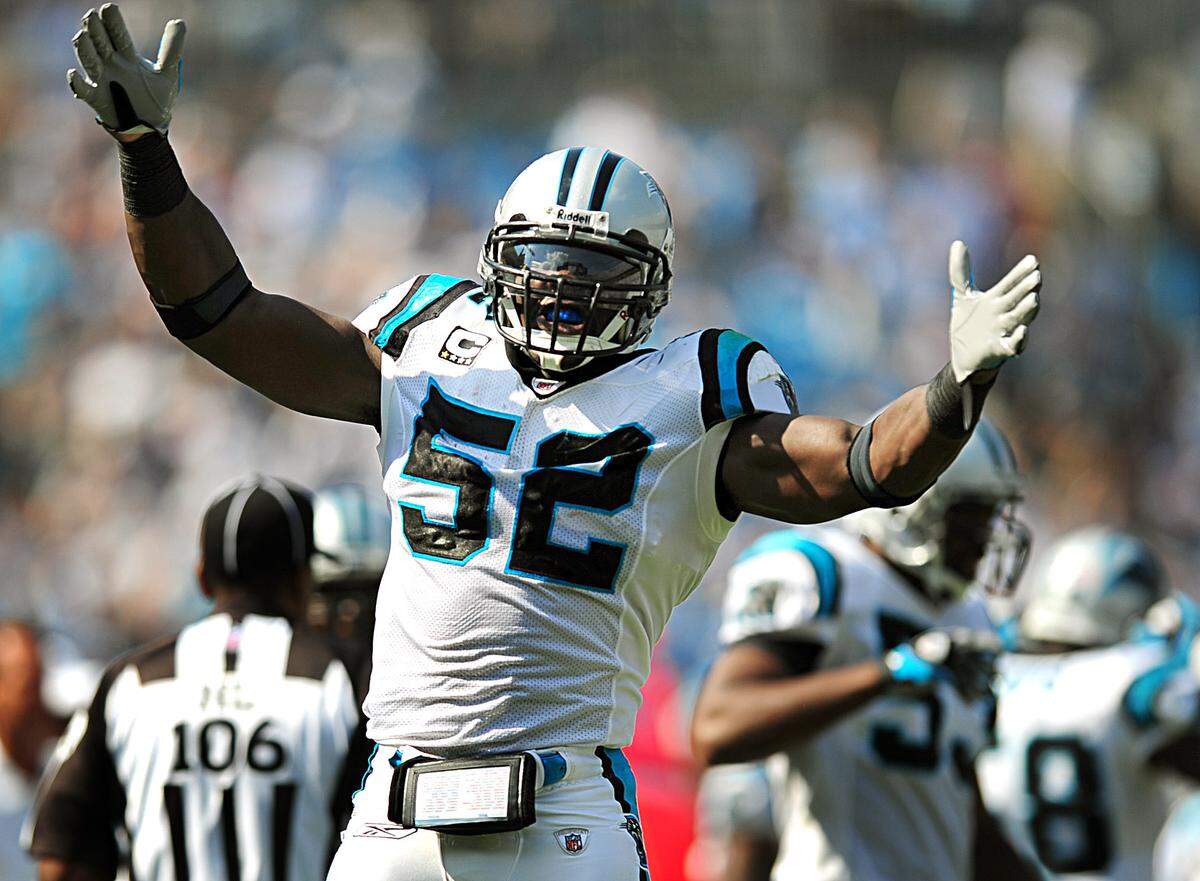 In 2008, Carolina Panthers linebacker Jon Beason (52) celebrates his interception of a pass against Kansas City. The Panthers defeated the Chiefs 34-0 during a playoff season in which Beason would make the Pro Bowl and lead the NFL in tackles.