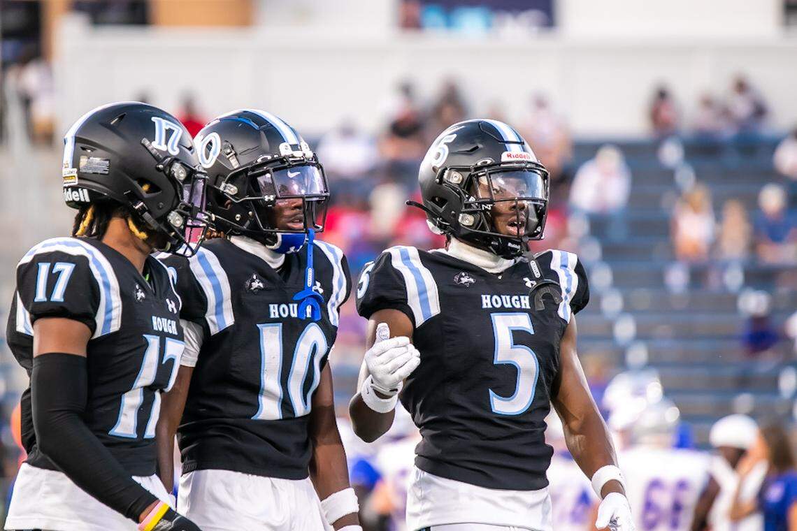 Hough players support each other after taking a loss of yards
