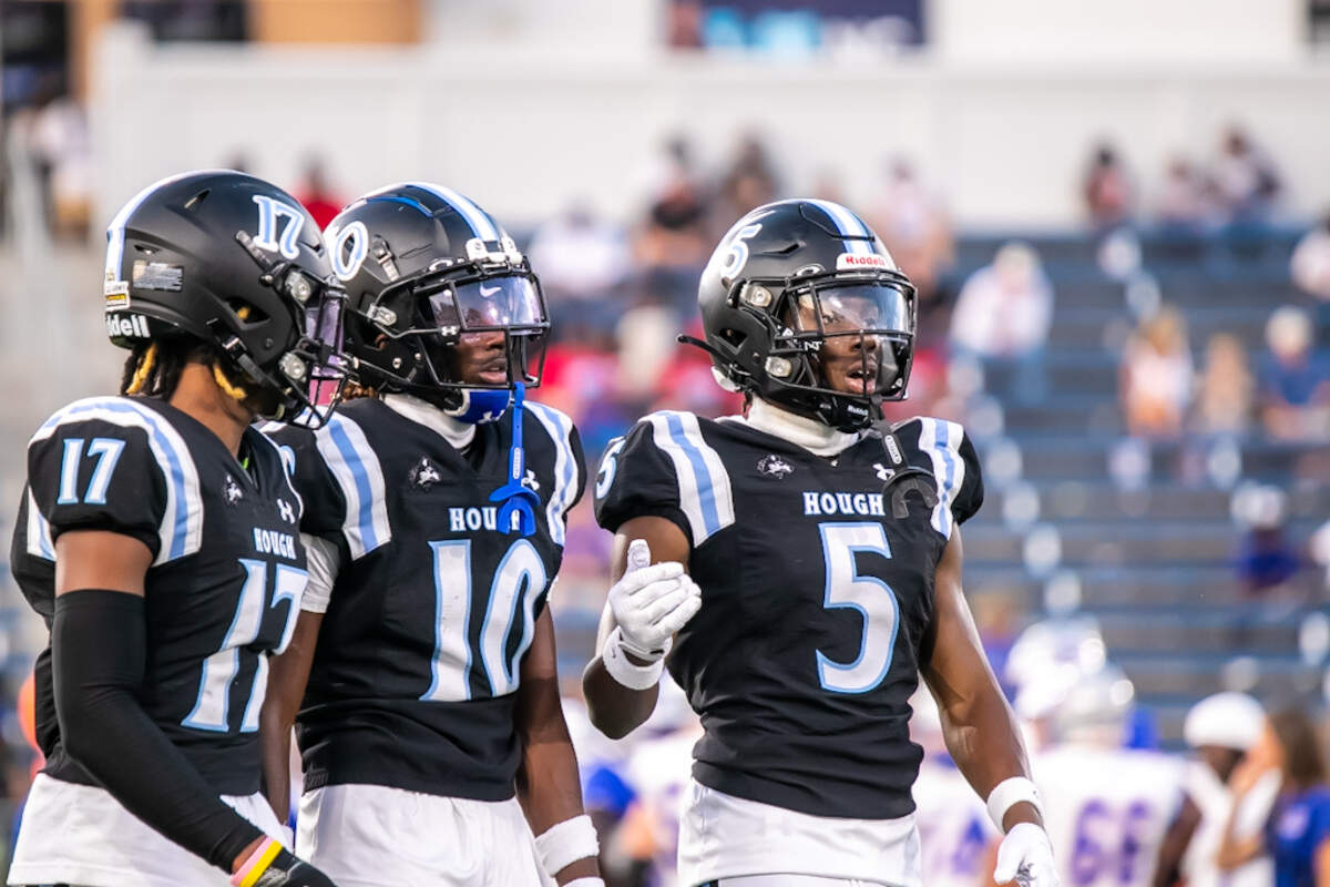 Hough players support each other after taking a loss of yards