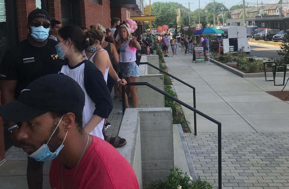 The line at Glory Days Apparel’s grand opening stretched down the block.