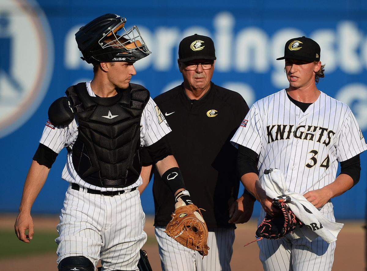 Charlotte Knights catcher Dustin Garneau (left), pitching coach Steve McCatty (center) and pitcher Michael Kopech walk to the team's dugout prior to action against the Lehigh Valley IronPigs on Friday, June 8, 2018 at BB&T Ballpark in Charlotte, NC. This week in Fort Mill history, in 1998, Charlotte Knights Brian Daubach, outfielder, and Alex Gonzalez, shortstop, were selected to play in the 1998 AAA All-Star game to be played at Norfolk’s Harbor Park.