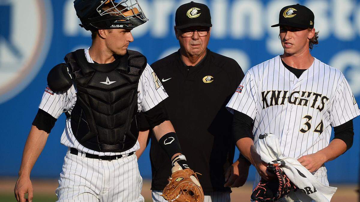 Charlotte Knights catcher Dustin Garneau (left), pitching coach Steve McCatty (center) and pitcher Michael Kopech walk to the team's dugout prior to action against the Lehigh Valley IronPigs on Friday, June 8, 2018 at BB&T Ballpark in Charlotte, NC. This week in Fort Mill history, in 1998, Charlotte Knights Brian Daubach, outfielder, and Alex Gonzalez, shortstop, were selected to play in the 1998 AAA All-Star game to be played at Norfolk’s Harbor Park.