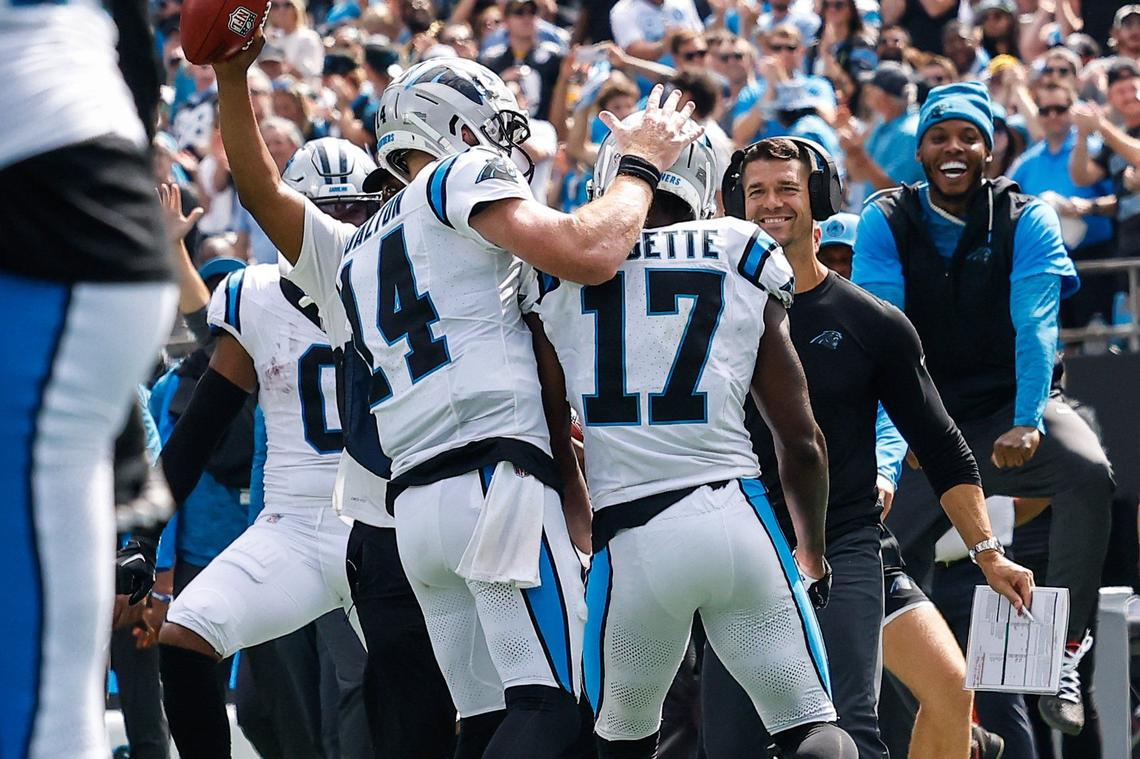 Panthers head coach Dave Canales, second from right, smiles as wide receiver Xavier Legette (17) approaches the sideline after scoring a touchdown during the game against the Bengals at Bank of America stadium in Charlotte, NC on Sunday, September 29, 2024.