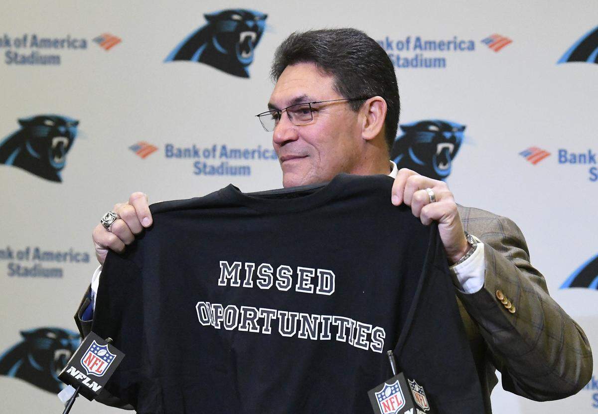 Former Carolina Panthers head coach Ron Rivera holds up a t-shirt at the end of a press conference at Bank of America Stadium on Dec. 4th. Rivera often used the phrase “Missed Opportunities” when describing what went wrong in a Panthers loss.