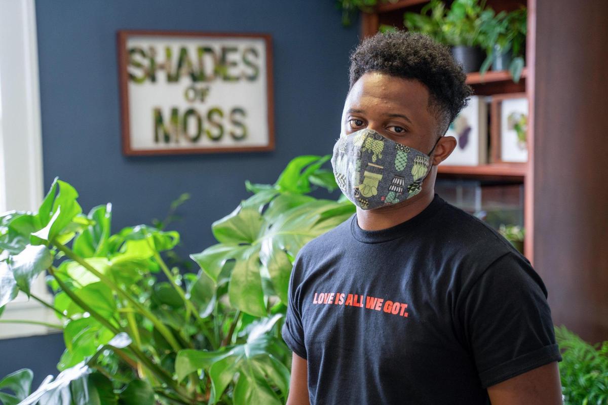 On August 7, Shades of Moss owner Barry Greene stands in his shop in the Elizabeth neighborhood on 7th Street.