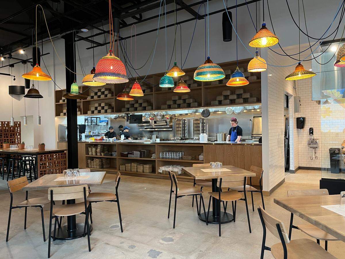 Natural materials are found throughout MAS, accented by a variety of woven light fixtures the dining room.