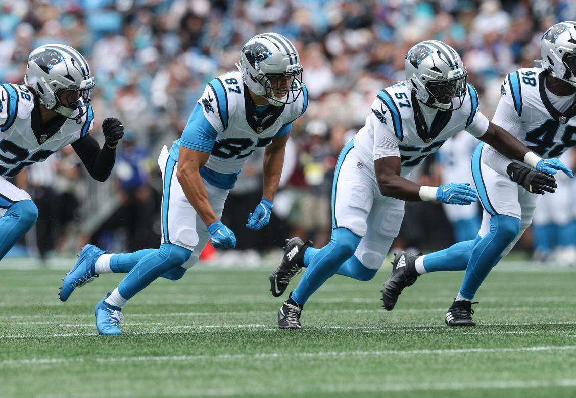 Panthers special teams players Brycen Tremayne, second from left, and Bam Martin-Scott, second from right, rush the field during the game against the Dolphins at Bank of America Stadium in Charlotte, NC on Sunday, October 5, 2025.