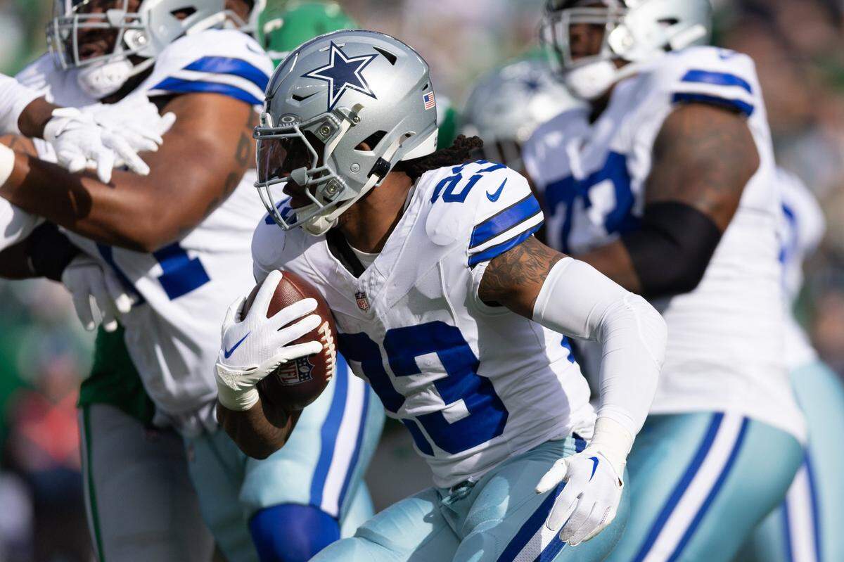Dec 29, 2024; Philadelphia, Pennsylvania, USA; Dallas Cowboys running back Rico Dowdle (23) runs with the ball against the Philadelphia Eagles during the first quarter at Lincoln Financial Field. Mandatory Credit: Bill Streicher-Imagn Images