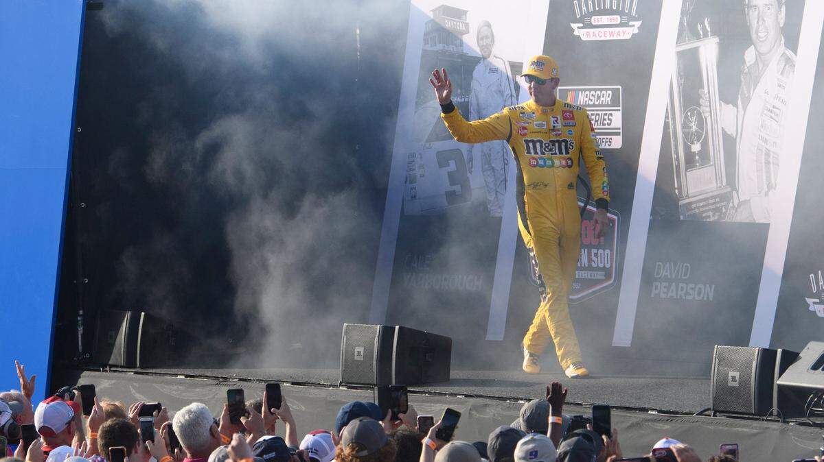 Kyle Busch, pictured here as he’s introduced before the NASCAR playoff race at Darlington on Sunday, was fined Monday for reckless entry to his garage.