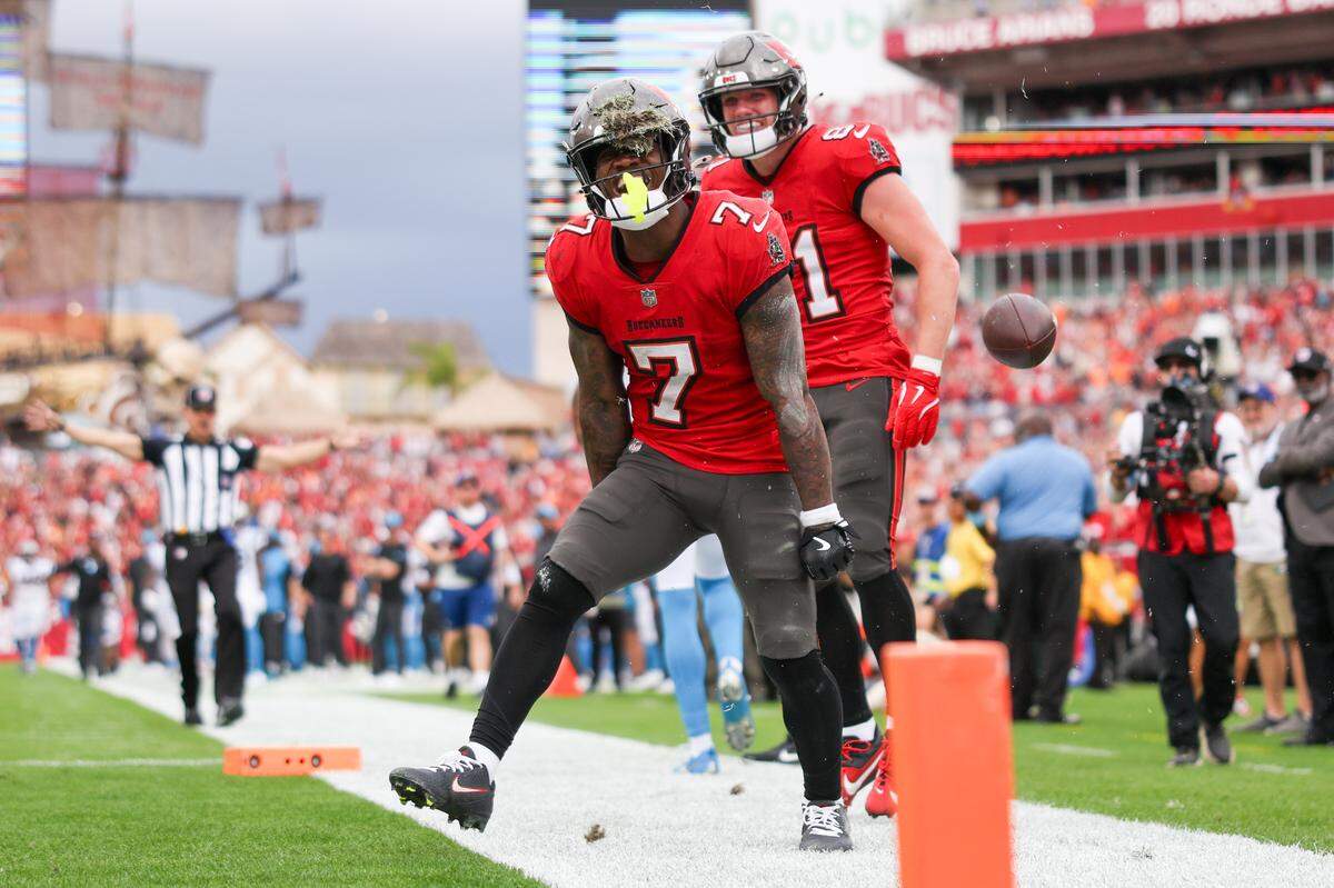 Tampa Bay Buccaneers running back Bucky Irving (7) celebrates after his team scored a touchdown against Carolina Sunday. Tampa Bay won, 48-14, as Carolina set a dubious record for the most points allowed in a season in team history.